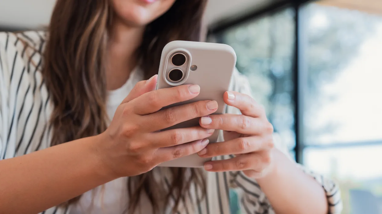 Woman using medical spa software, with built-in social media tools to drive sales and boost revenue.
