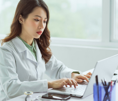 Medical Professial logging into her computer