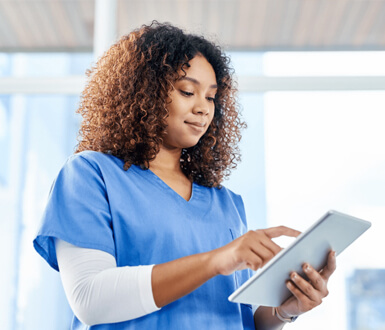 Medspa employee uses medical spa software on her tablet