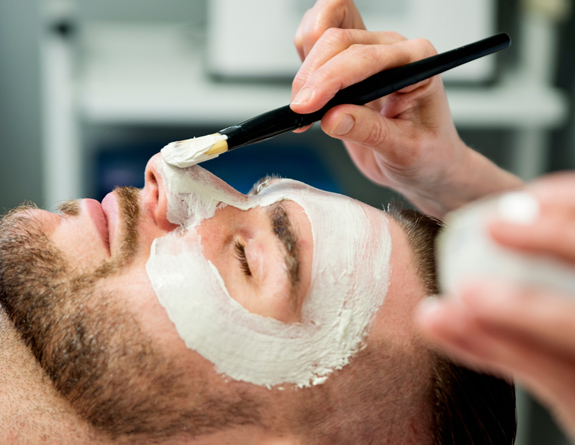 Man getting treatment scheduled through spa management software