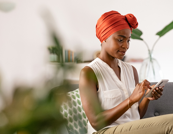 Medspa owner using EMR for medspa on mobile during vacation.