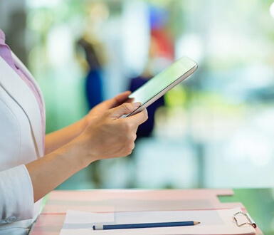 A person holding a tablet