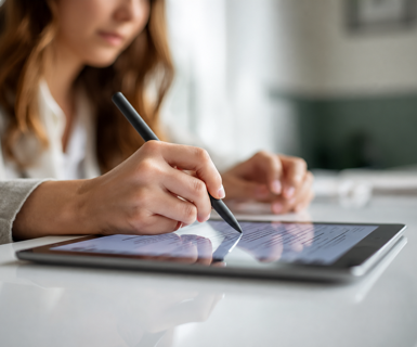 Med spa client signing a digital consent form on a tablet, part of the smooth intake process clients notice before booking